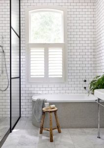 White Plantation Shutters in bathroom
